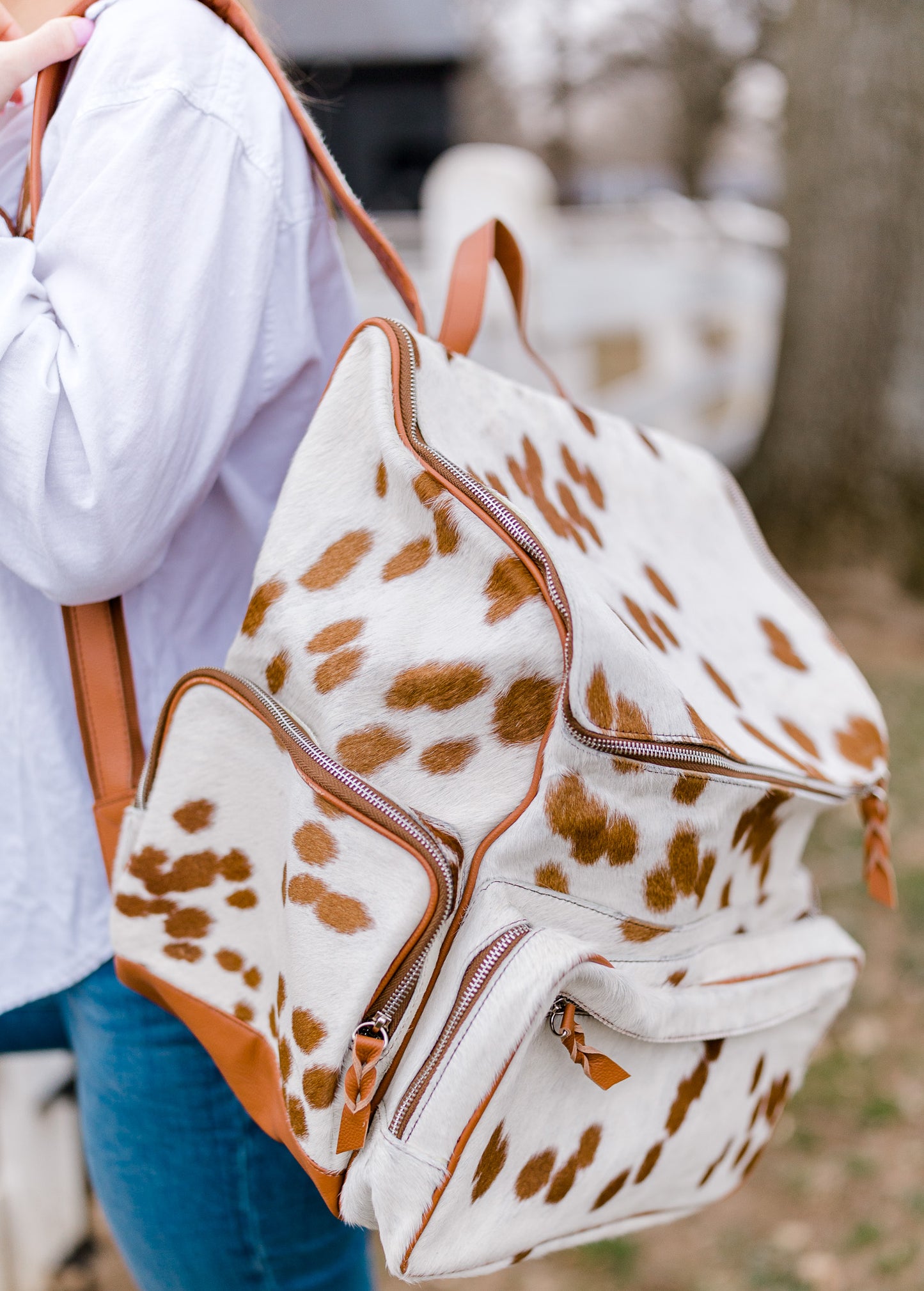 Brown and White Cowhide Backpack